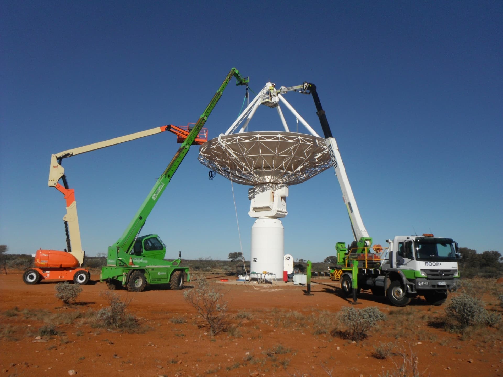 Radio telescope dish with composite components being installed in the Australian outback